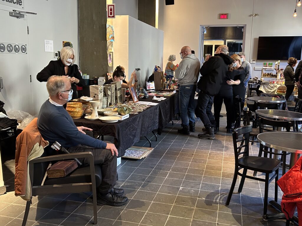 View of Rene Pellerin's table with a spread of Andre Pellerin's ceramics.