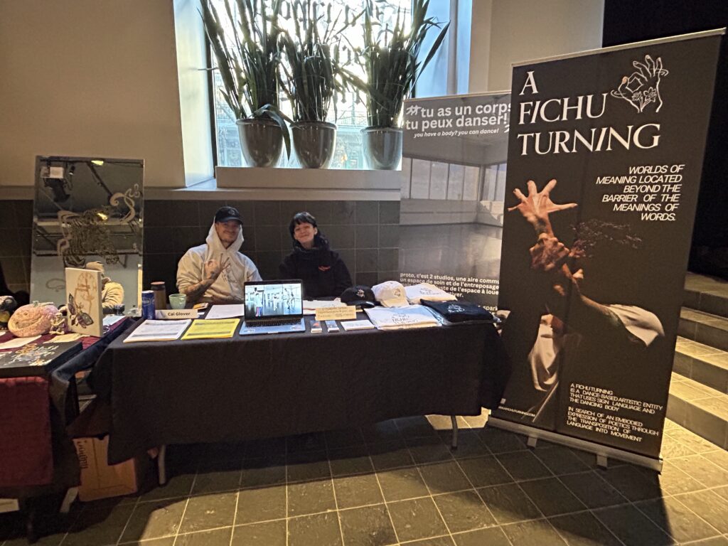 A Fichu Turning's booth with photos.